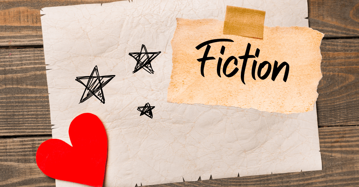 Fiction Page Header: A sheet of paper with stars sketched on it, weighted down with a red heart. There is a faded peice of parchment stuck to it with masking tape. The parchment contains the handwritten word 'fiction'.