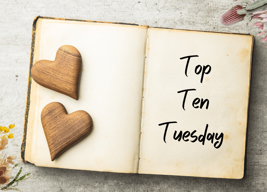 Open book with the left pages weighted down by two wooden hearts, and the write page showing the words 'Top Ten Tuesday'. The top right and bottom left corners of the page are bordered by Australian wildflowers.